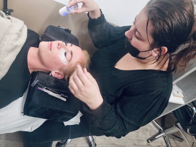 Jessica applying eyelash extensions